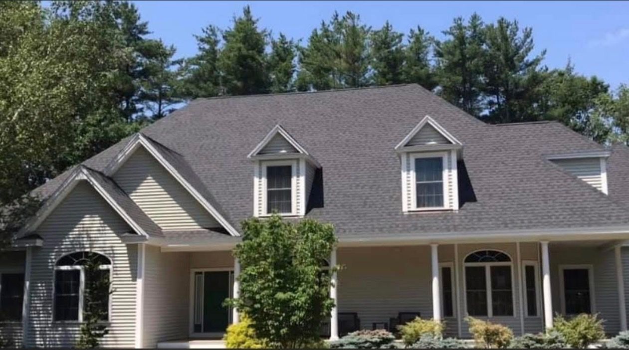 Gray metal roof on a house under construction.