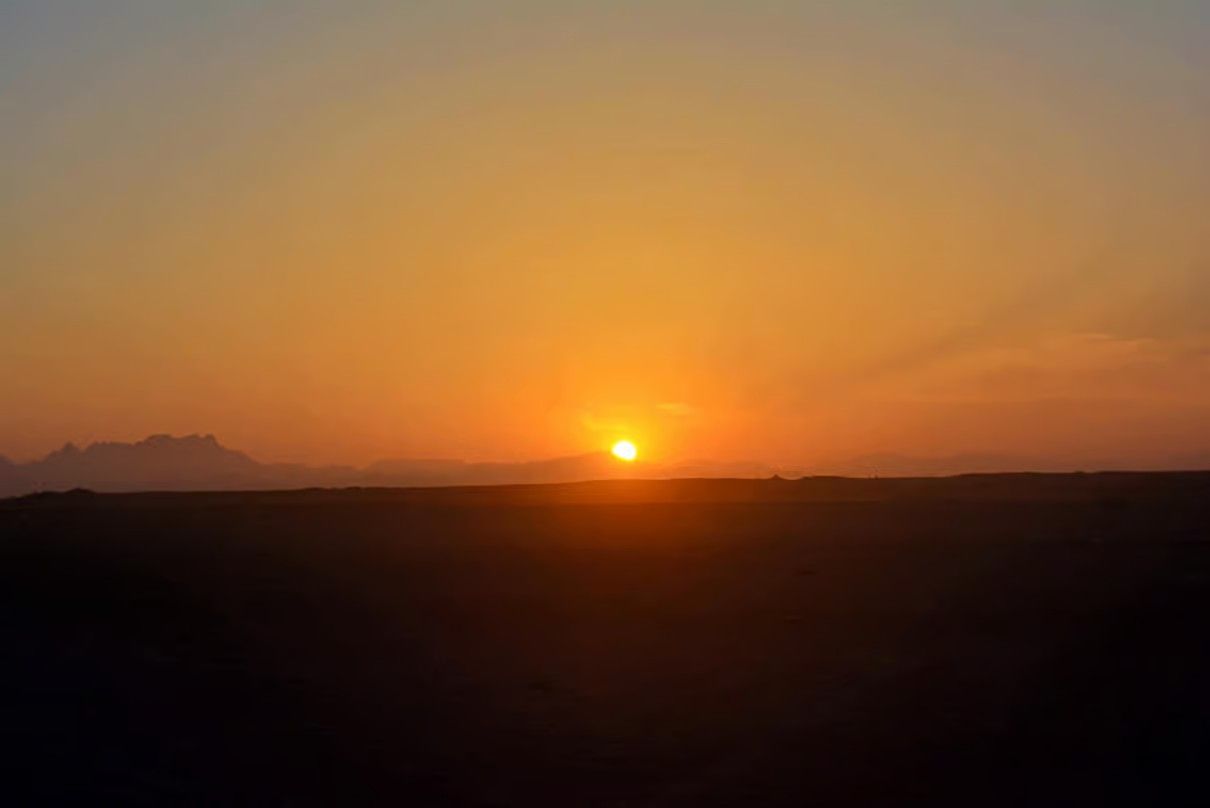 Hurghada desert safari at sunset with golden sand dunes and beautiful Egyptian desert landscapes.