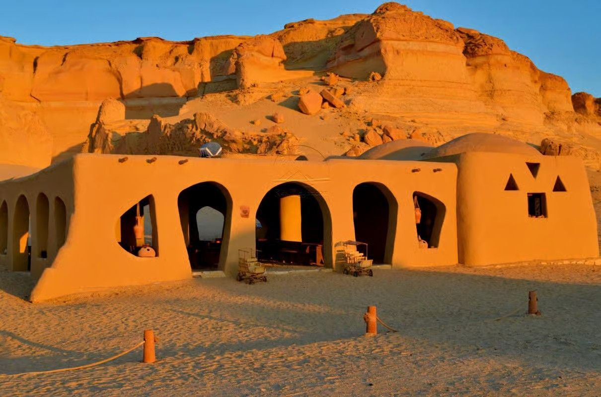 Fayoum Egypt landscape with Magic Lake, Wadi El Rayan waterfalls, desert mountains and Tunis Village