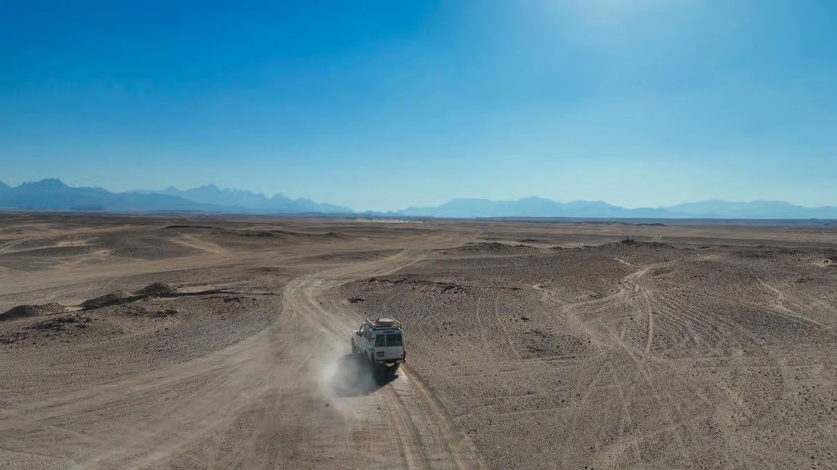 Hurghada desert safari with golden landscapes, Bedouin village, camel experience .