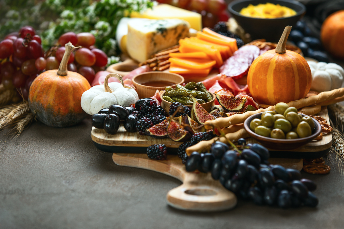 A wooden cutting board with a variety of food on it