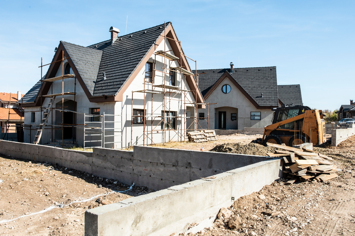 A house that is being built with scaffolding around it