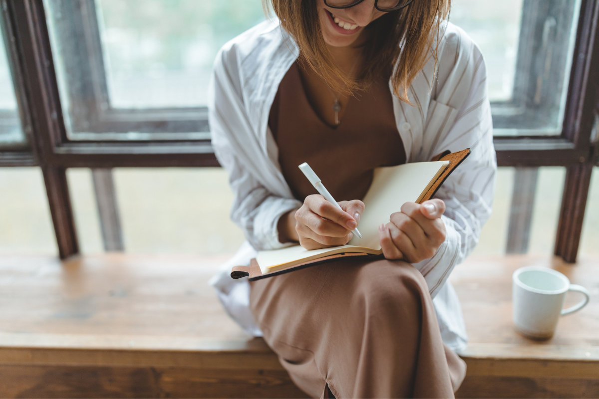 Woman marketing off items on checklist