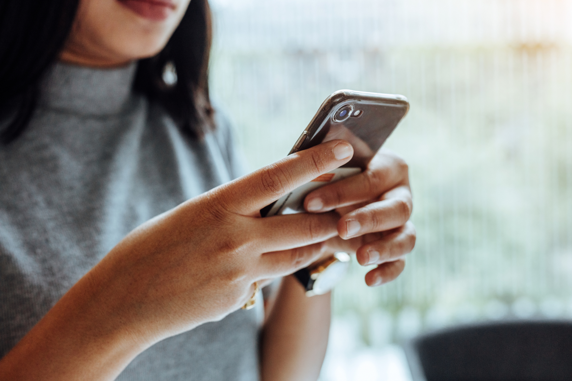 Woman viewing tiktok on a smartphone