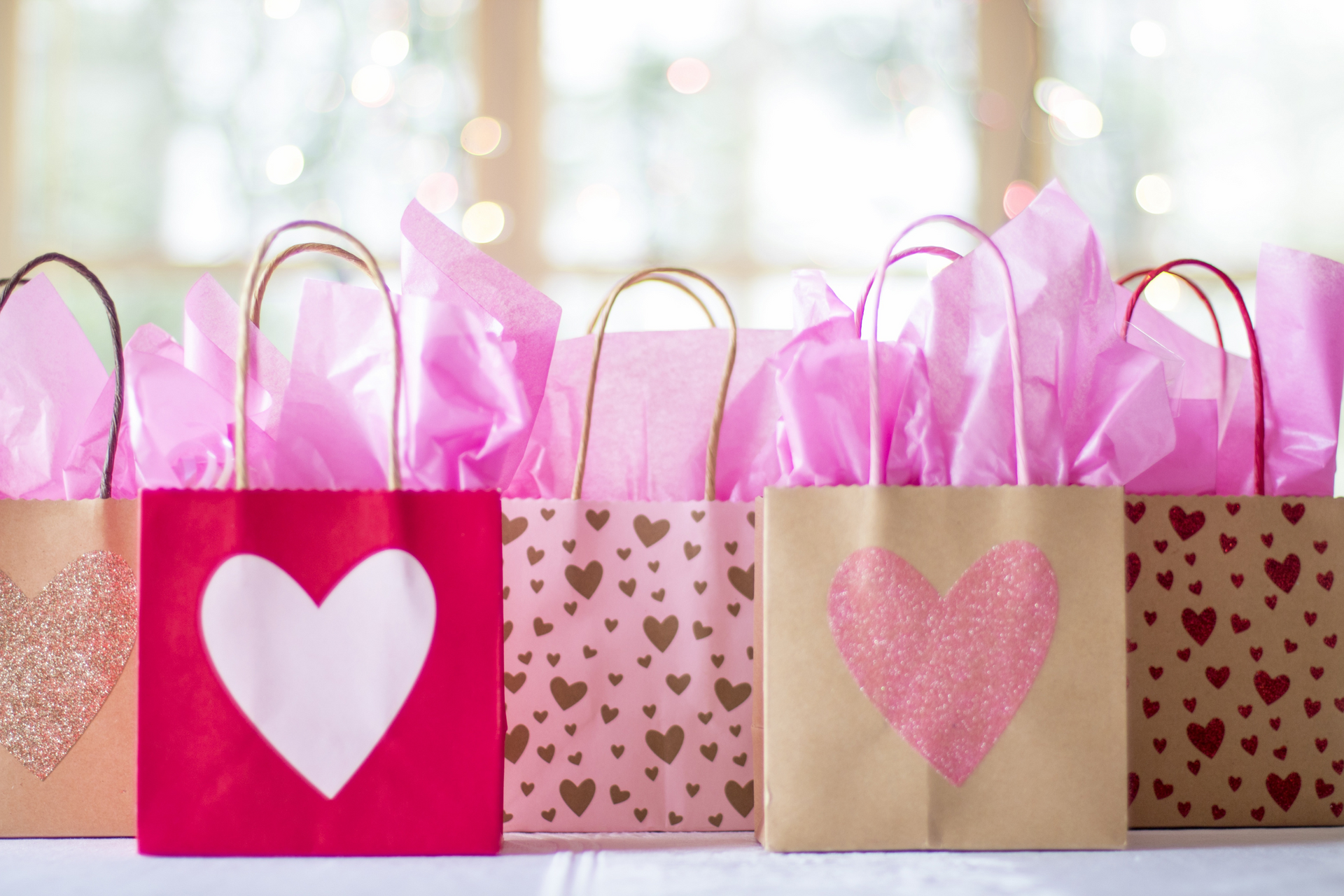 A row of gift bags with hearts on them