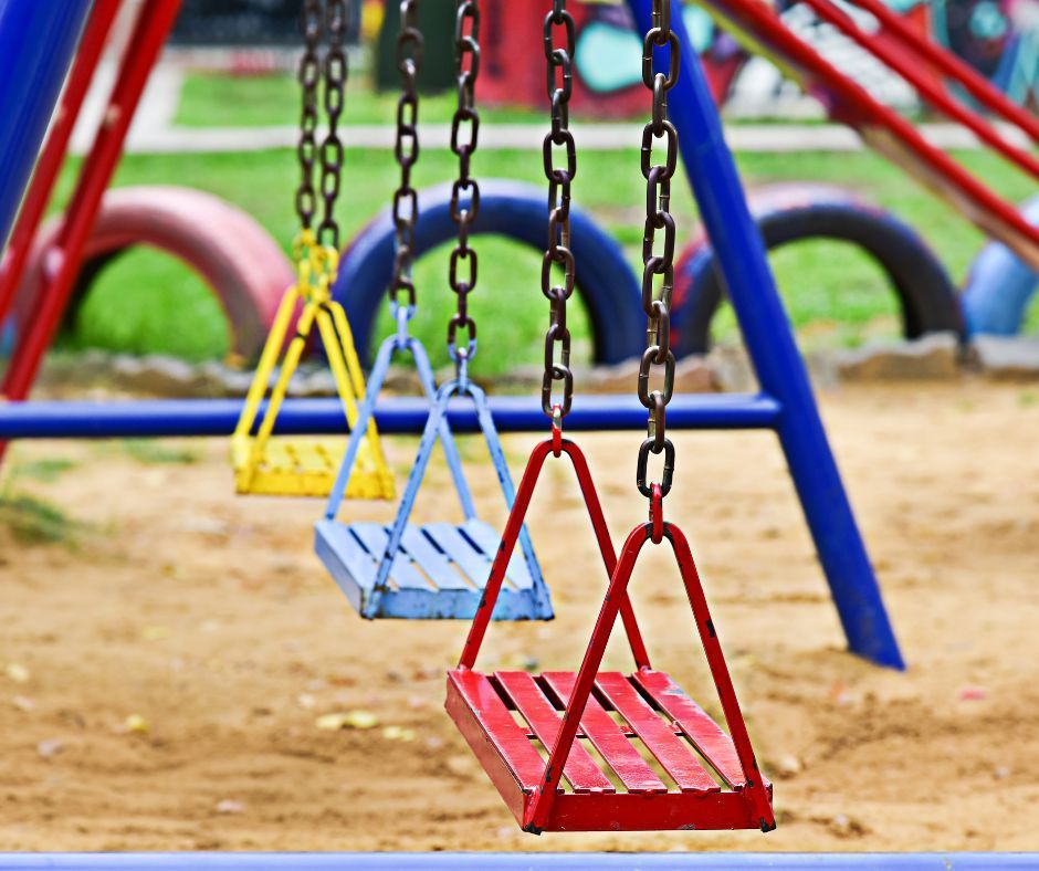 A row of colorful swings in a playground