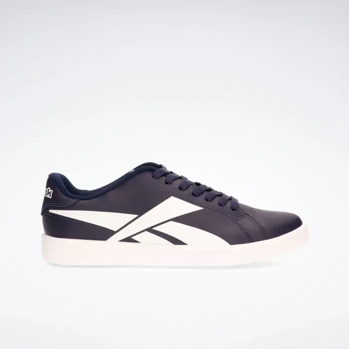 Zapatillas bajas azul marino oscuro con suela blanca y franja lateral sobre fondo blanco.