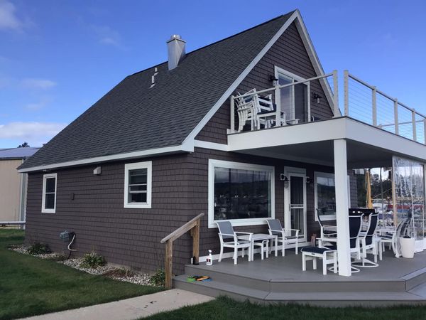 a house with a large porch and a balcony