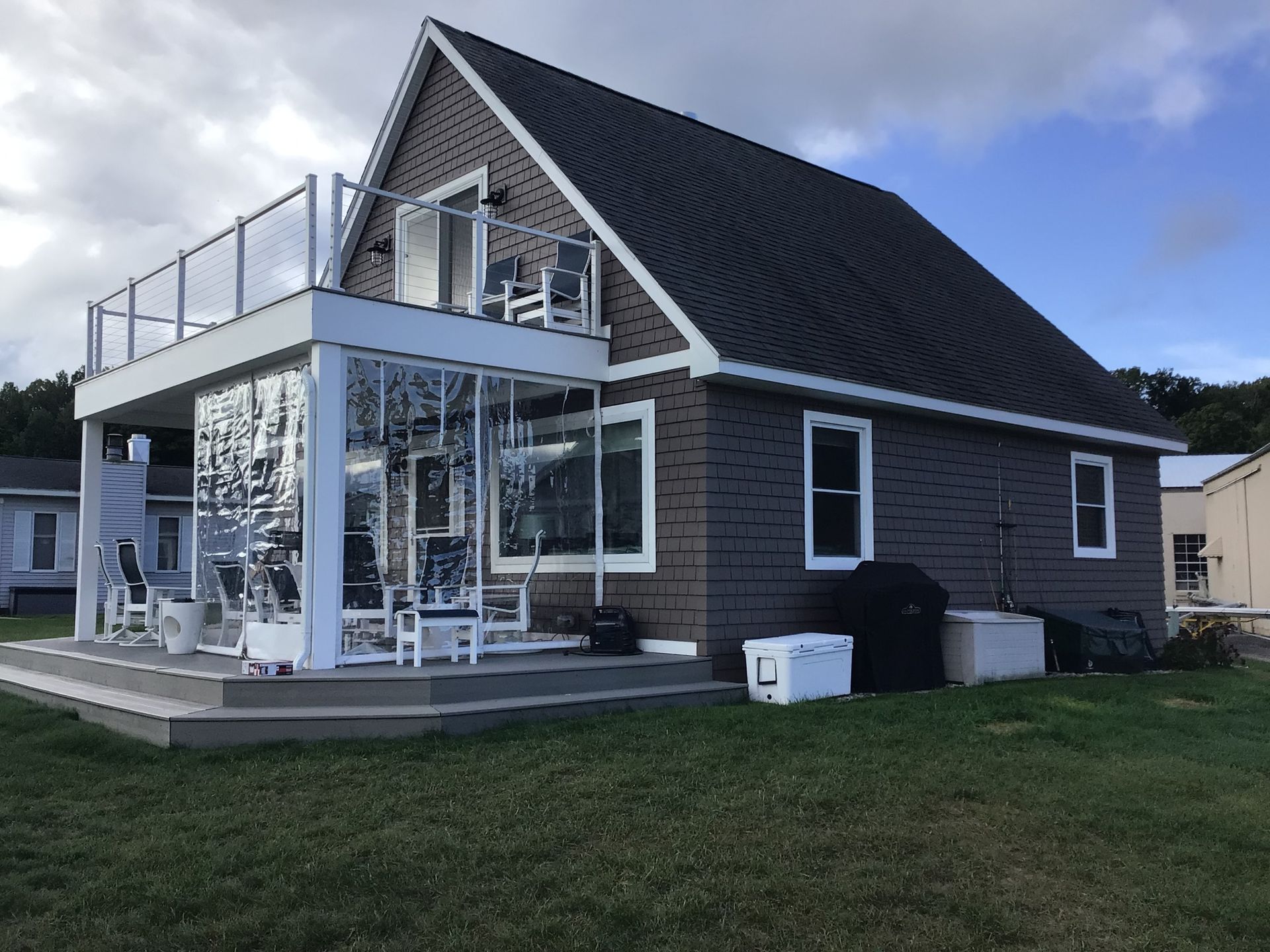 A house with a balcony on top of it
