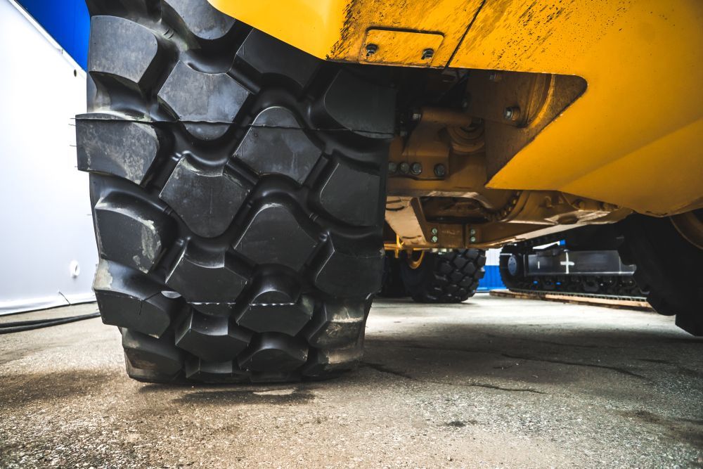 A Low-angle View Of A Thick, Treaded Tire — Auto Inspections & Road Services N.T in Woolner, NT