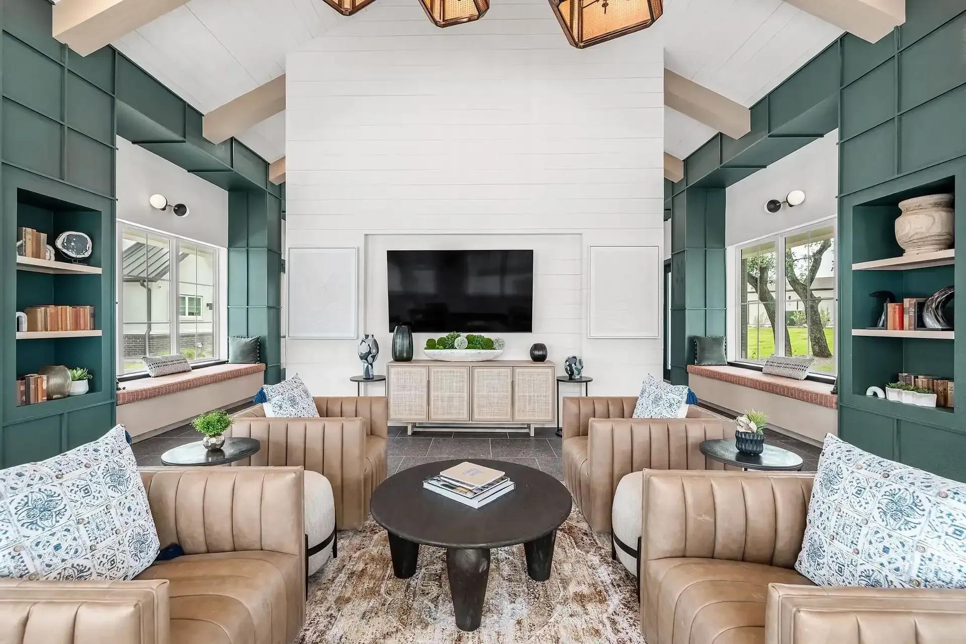 The clubhouse at The Gabriel, furnished with comfortable seating and a flat-screen TV, in Cedar Park, TX.