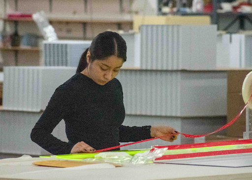 Exactec employee creating an acrylic display