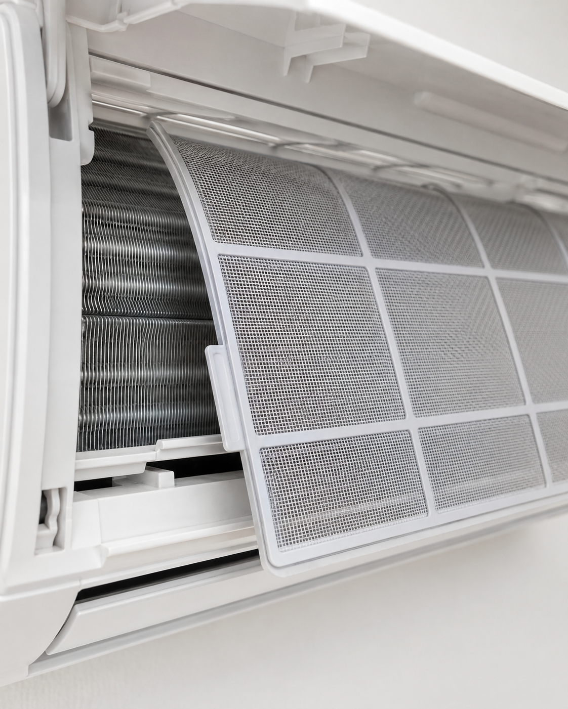 Open HVAC vent with a dusty white filter partially removed