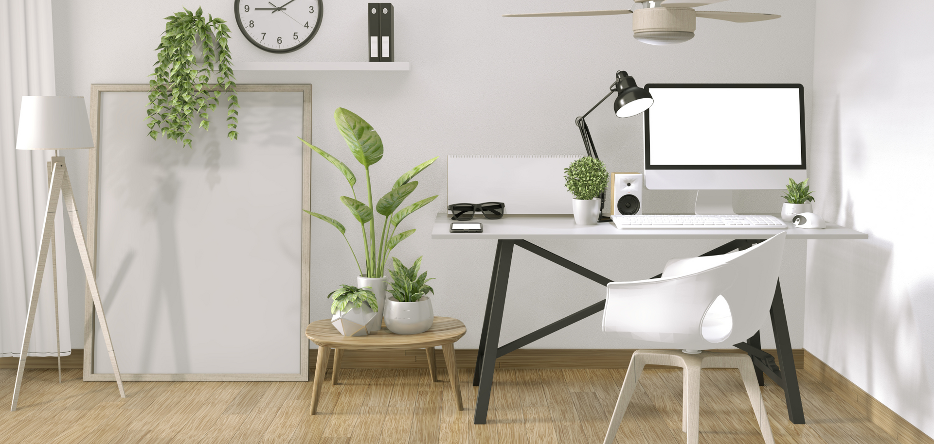 A home office with a desk , chair , computer , plants and a ceiling fan.