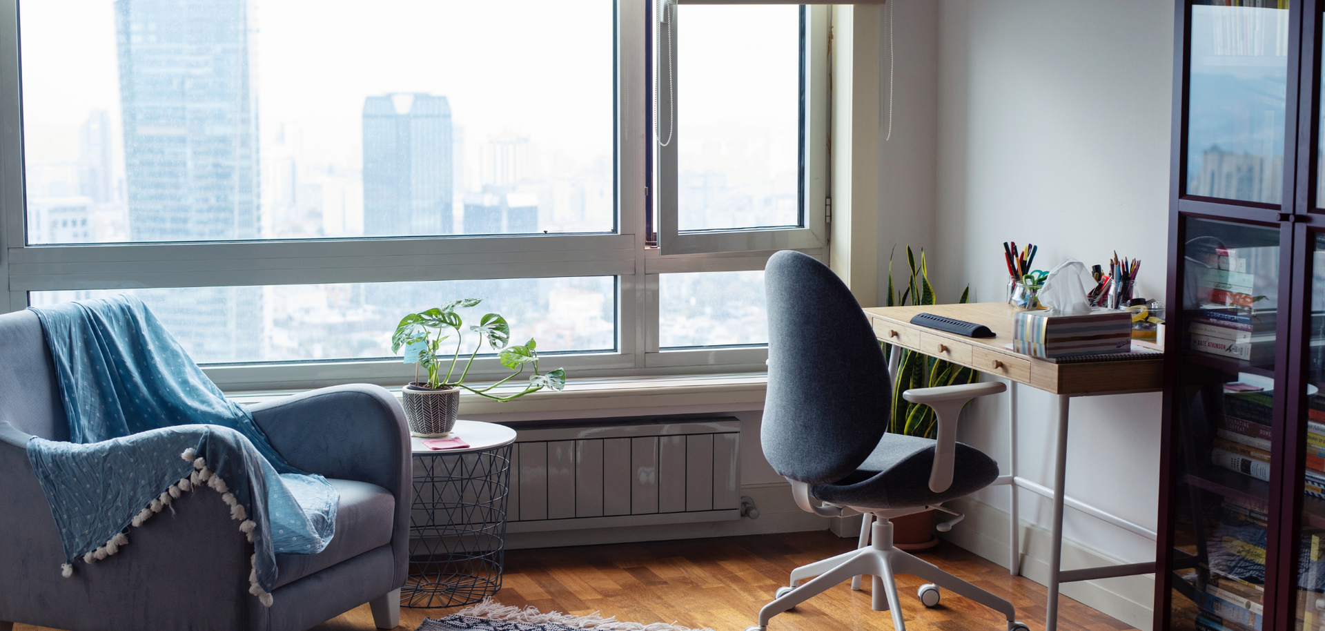 There is a chair and a desk in the room.