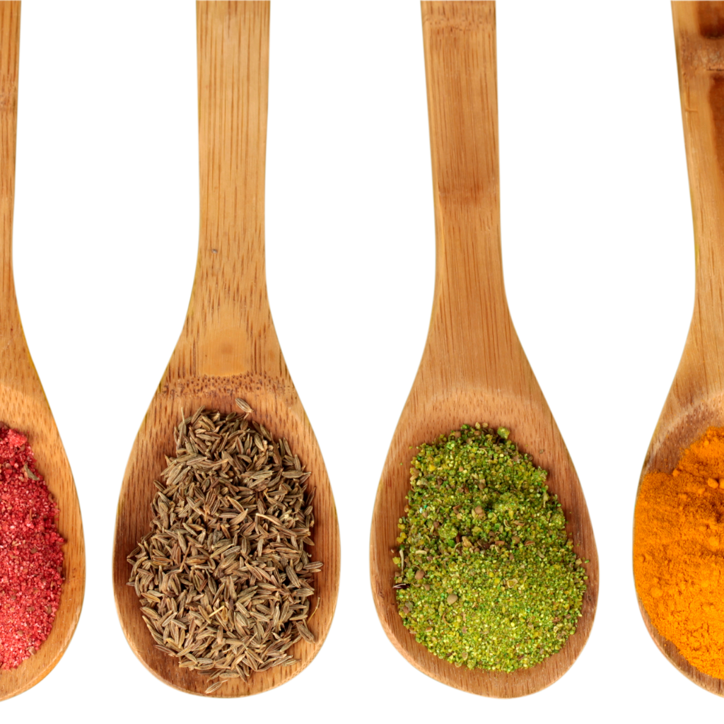 A row of wooden spoons filled with different spices