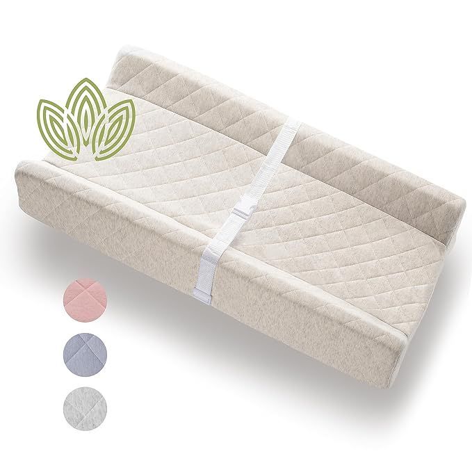 A changing table with a leaf on top of it.