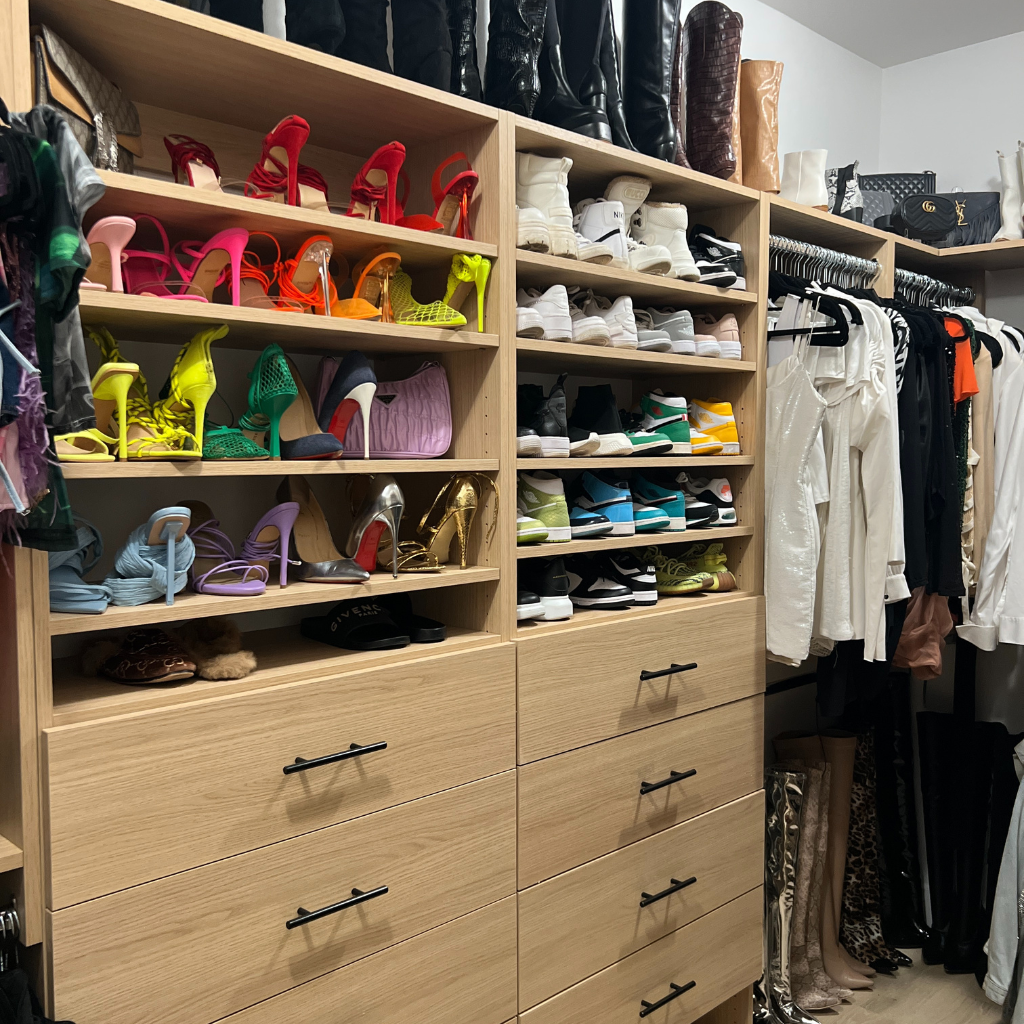 A closet filled with lots of shoes and clothes
