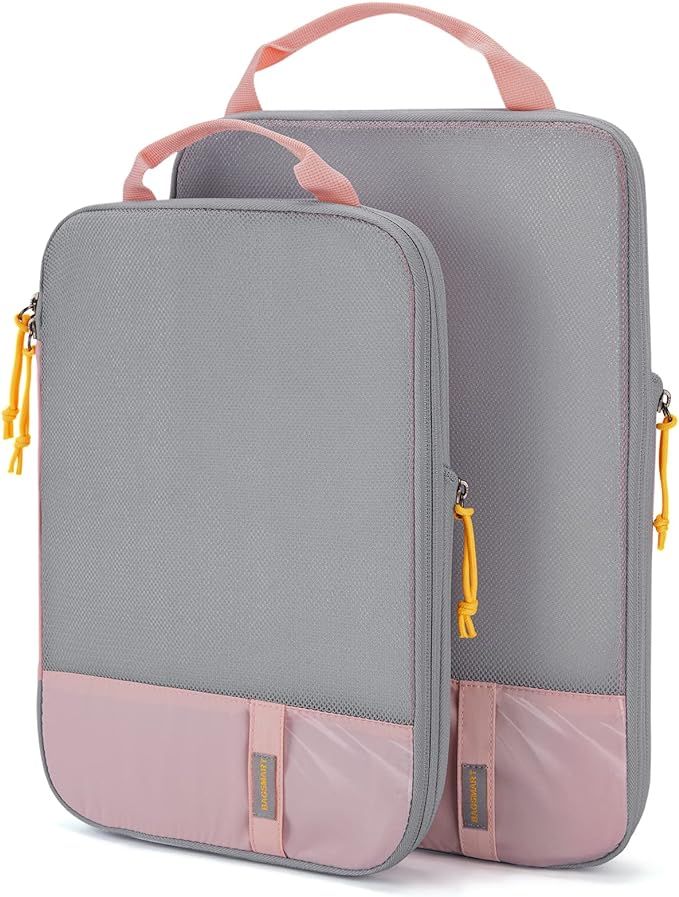 A gray and pink lunch bag with a handle on a white background.