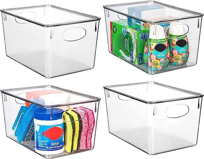 A set of four clear plastic bins filled with cleaning supplies.