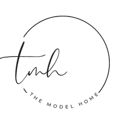 A black and white logo for the model home.