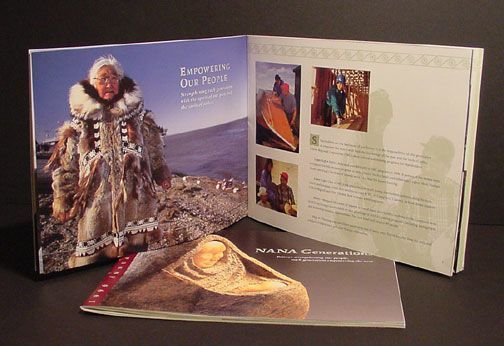 Open book brochure with an Inuit figure on the cover and text pages displayed on a white background