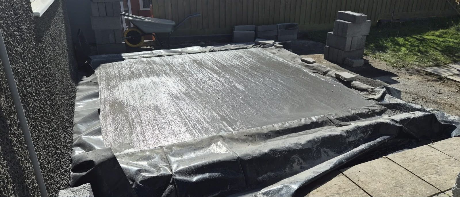 Damp proof membrane on a base