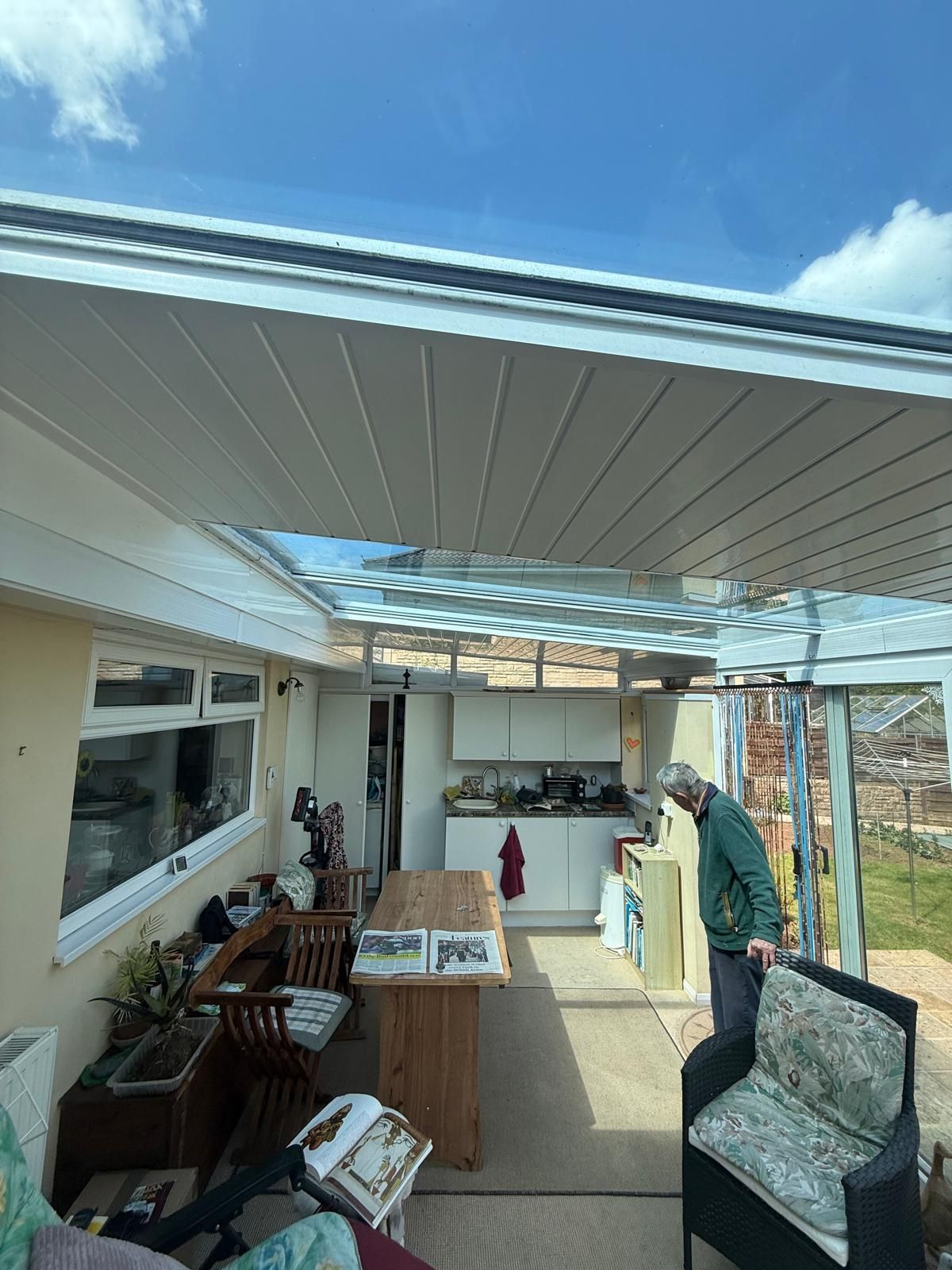 Conservatory with insulated solid panel roof upgrade