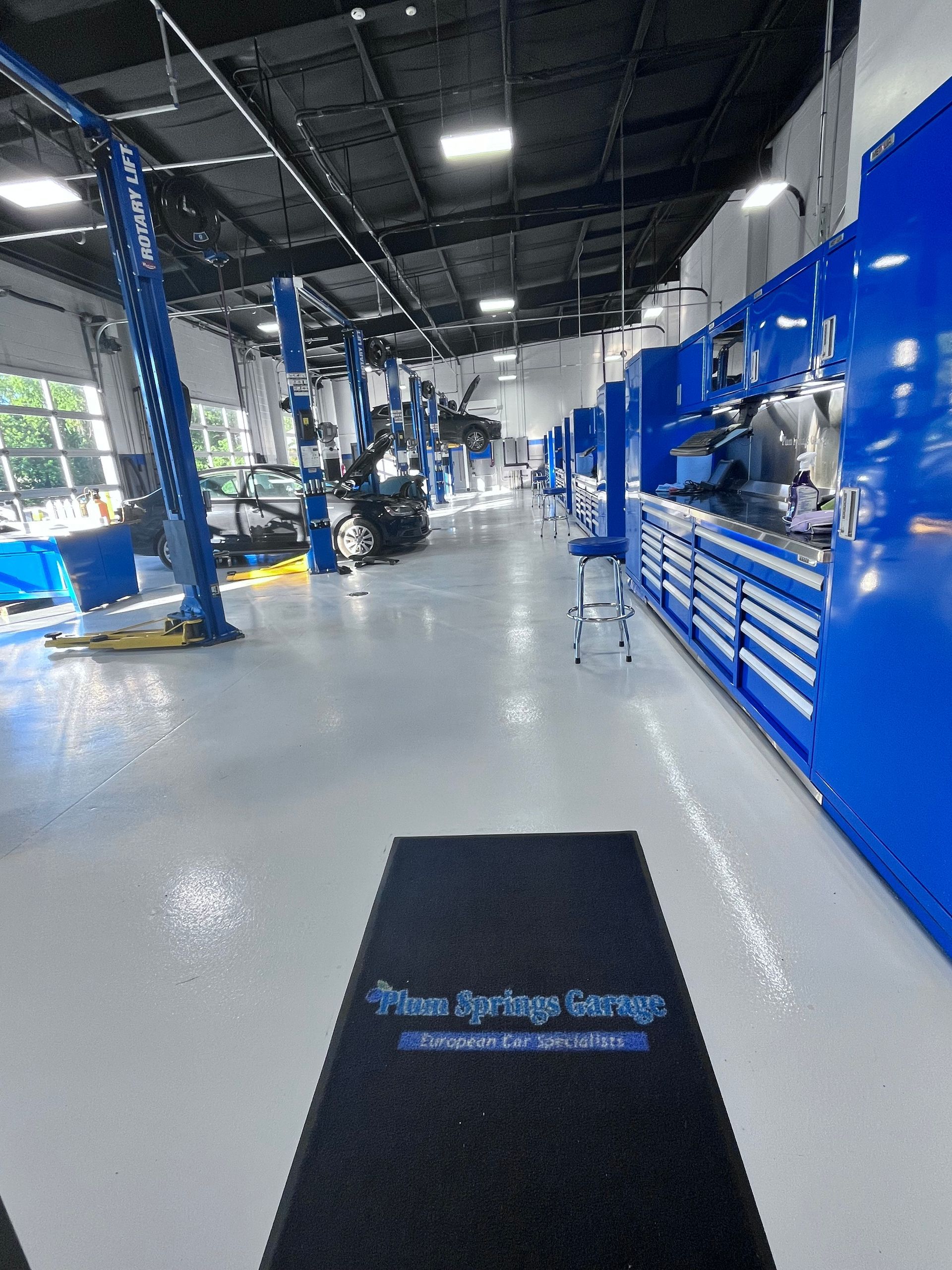 Bright auto repair shop interior | Plum Springs Garage