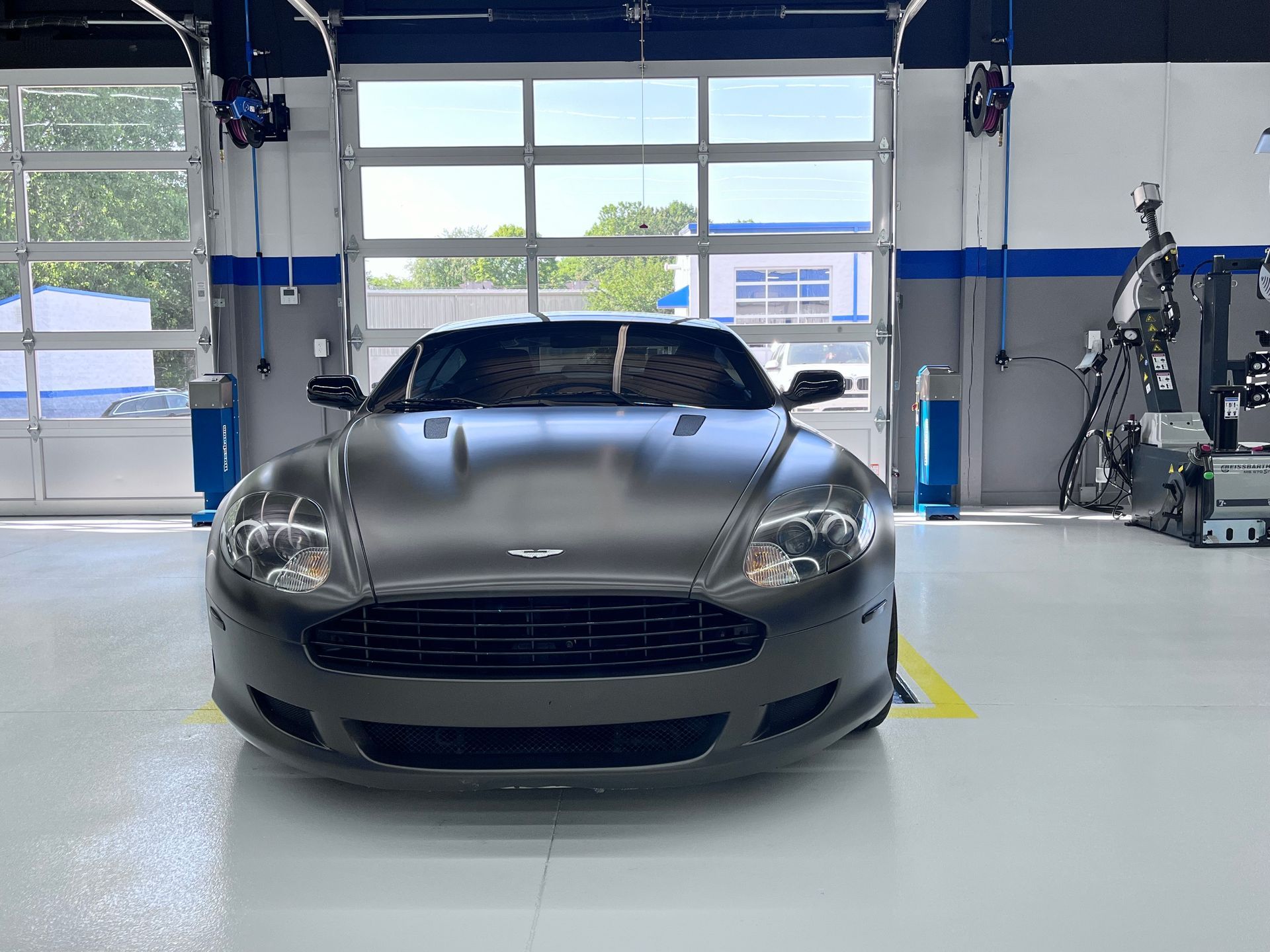 Gray Aston Martin DB9 inside the auto shop | Plum Springs Garage