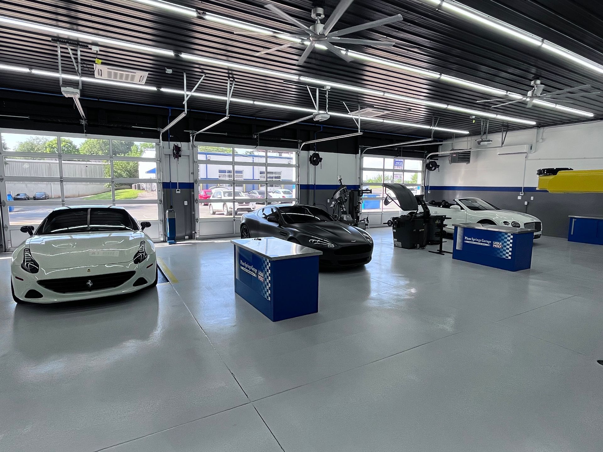 Cars inside the auto shop | Plum Springs Garage