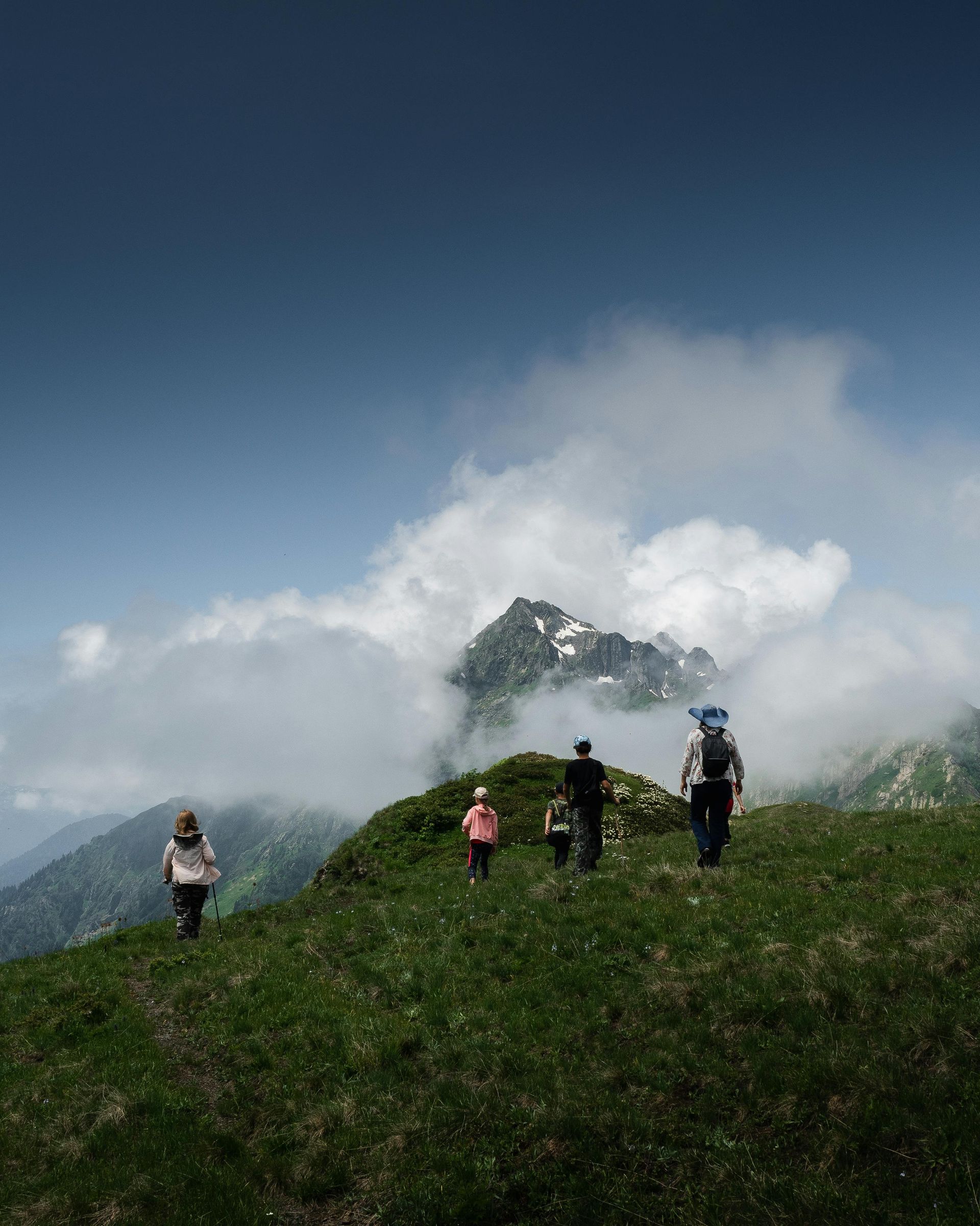 Professional fitness coach organizing a group hiking trip