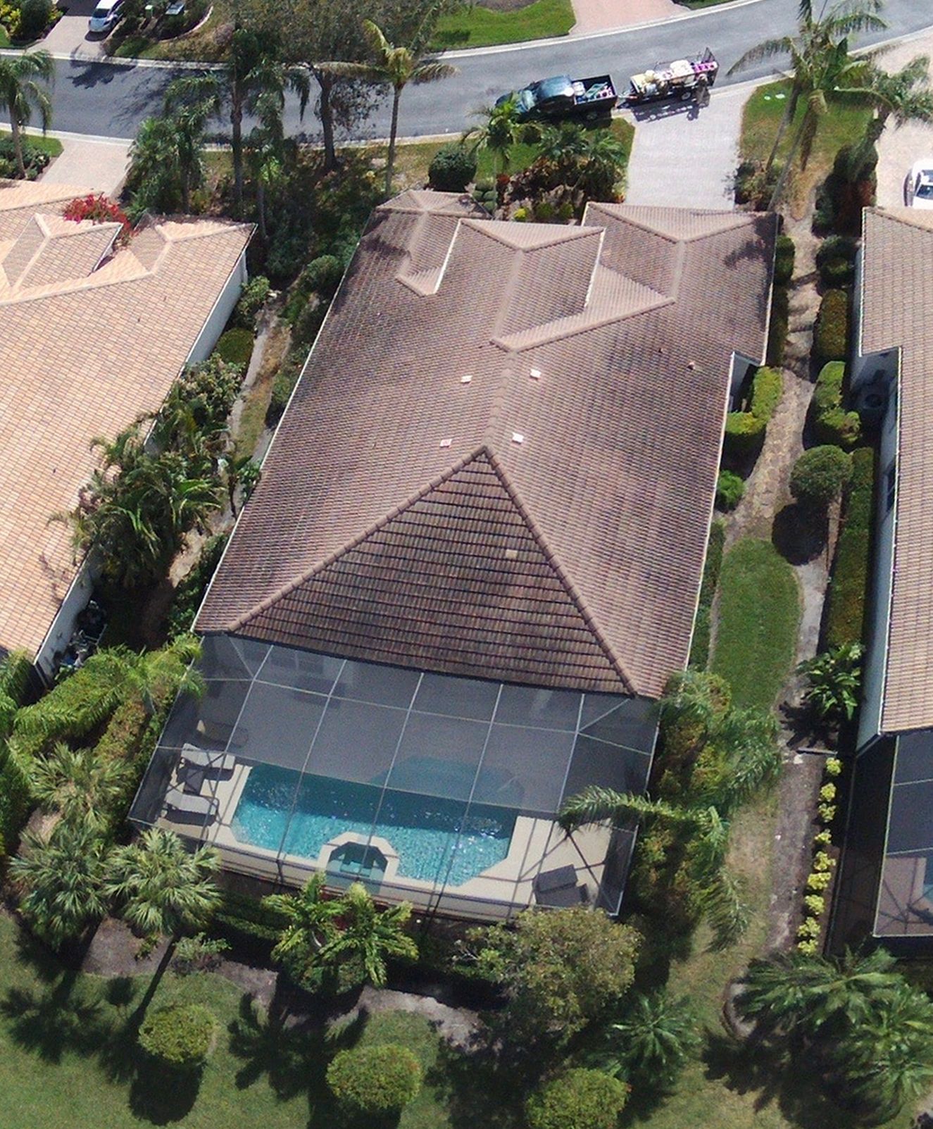 An aerial view of a house with a swimming pool