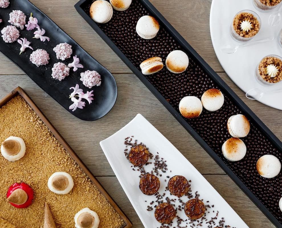 A selection of assorted desserts on various plates