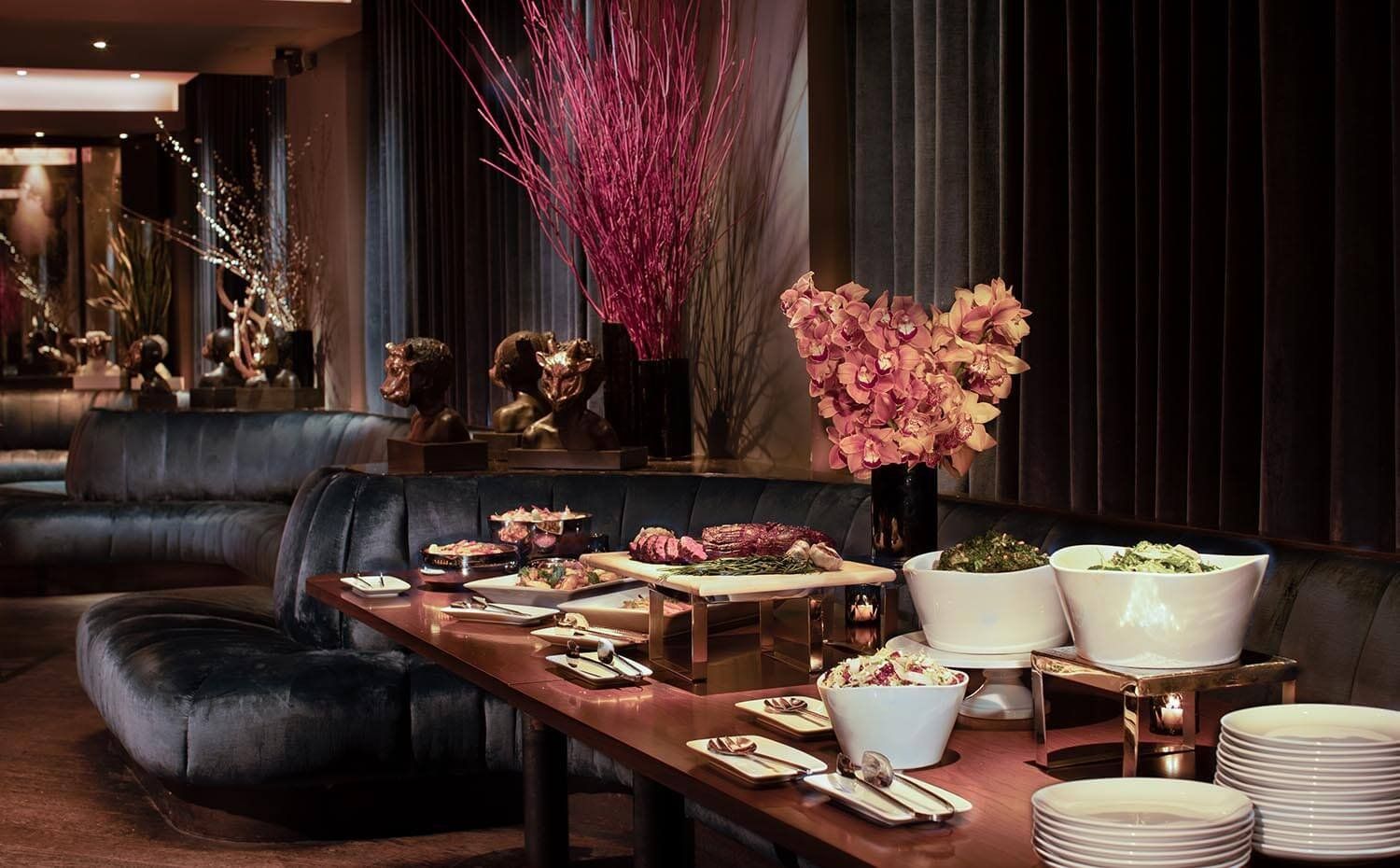 a buffet table with food and plates