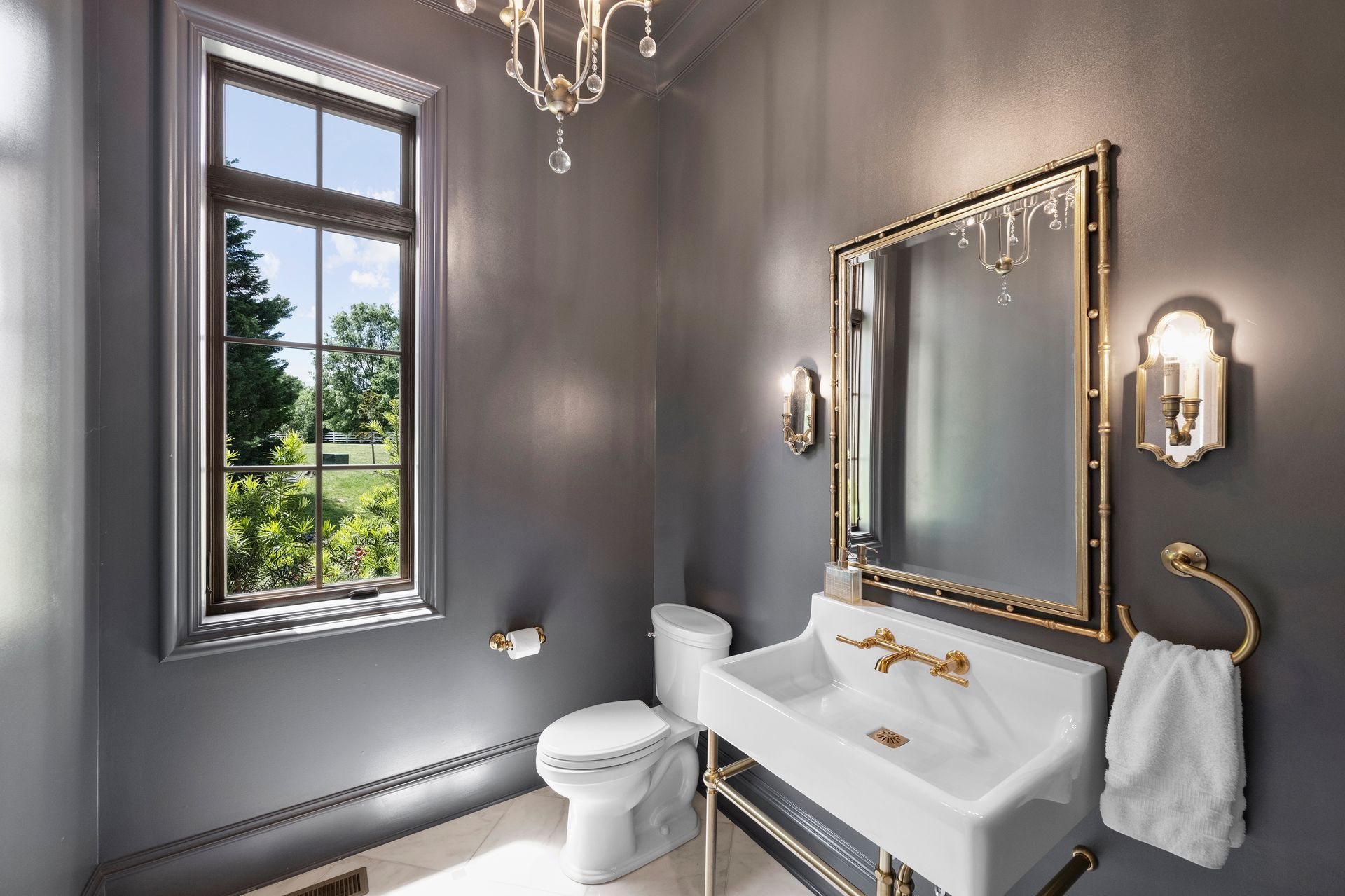 a bathroom with a toilet a sink and a mirror | Charlotte, NC | Harland Building Group 