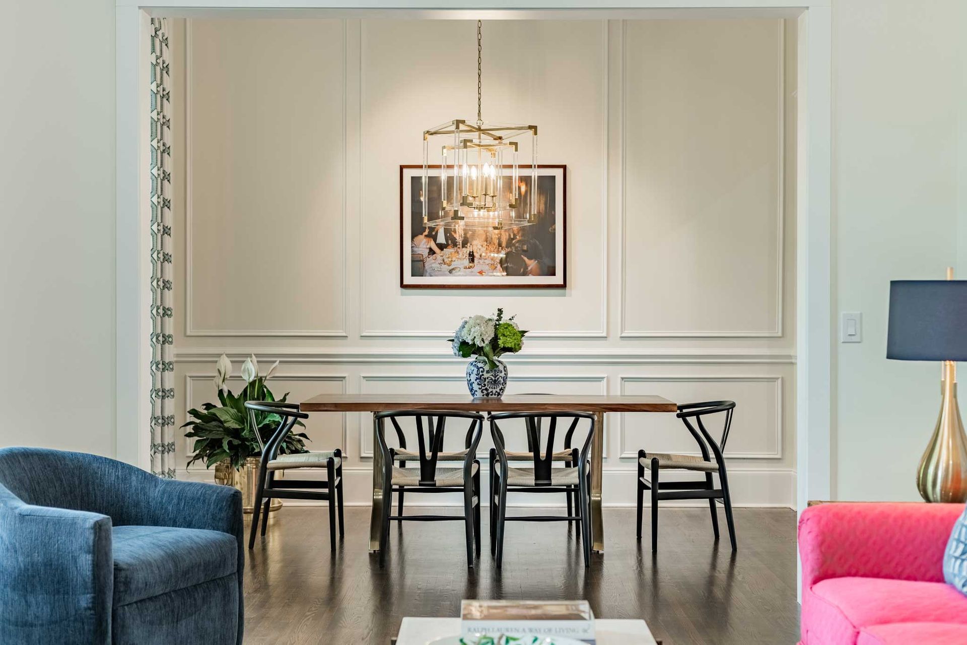 A living room with a dining room table and chairs