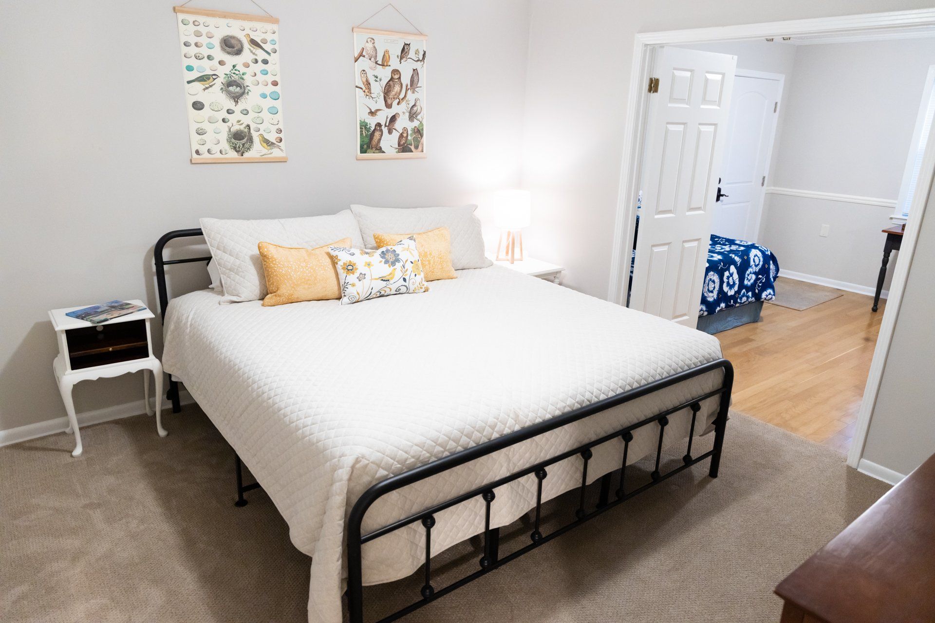 A bedroom with a king size bed and two nightstands.