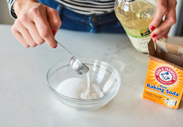 Baking soda and vinegar mixed to clean drains.
