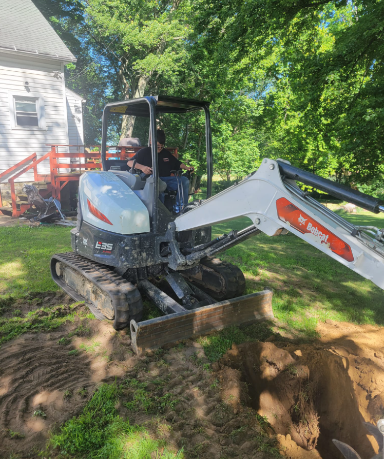 Backhoe digging trench