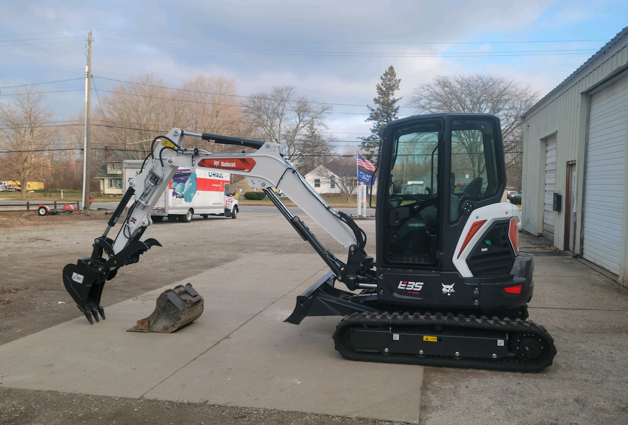 Vince's Drain Cleaning & Plumbing Bobcat backhoe.