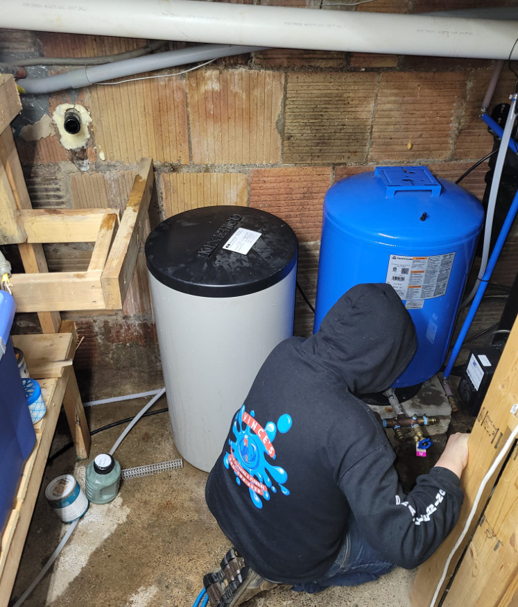 Plumber Replacing a water well pump