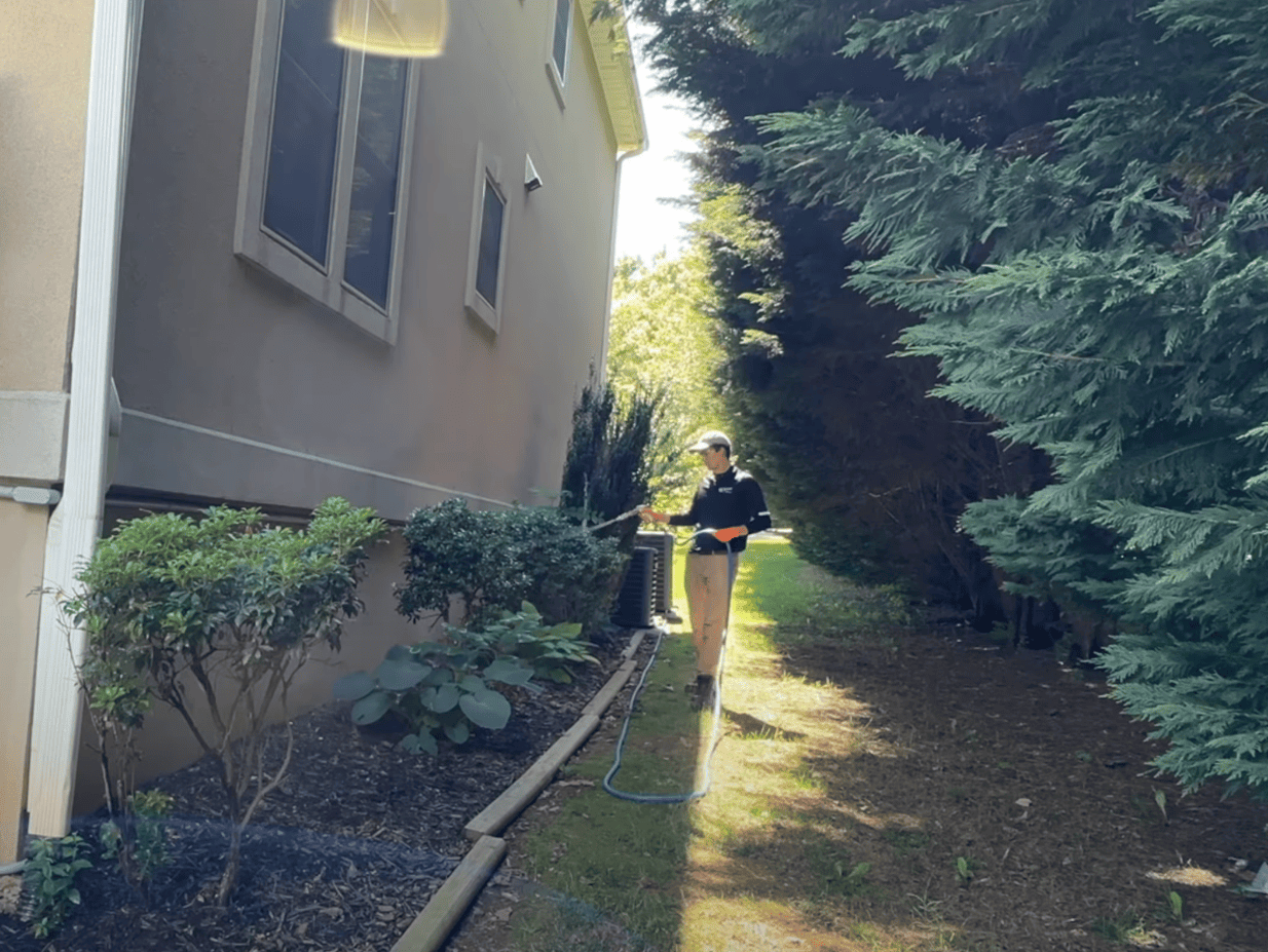 Pest Control | Exterminator applying pesticide to garden