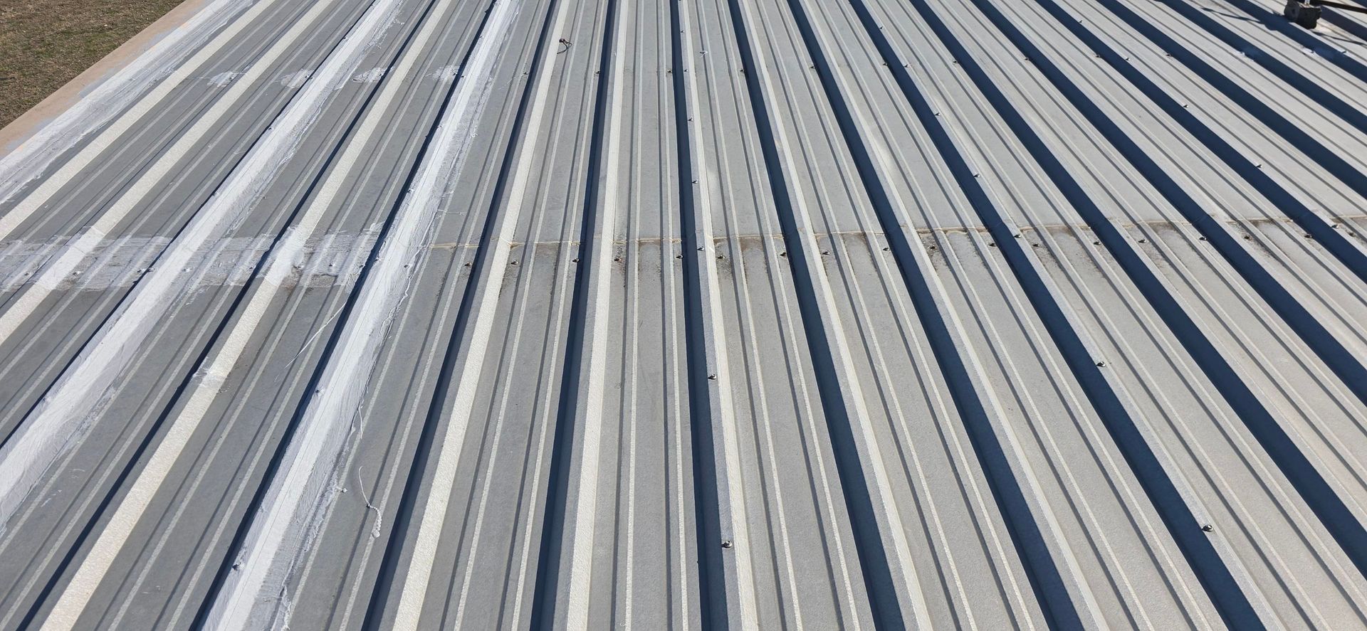 Rows of long blue, gray, and white striped panels stretching into the distance