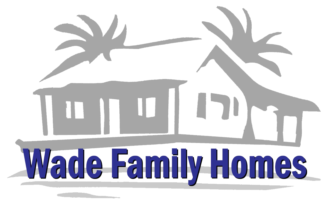 Logo for Wade Family Homes featuring a grey outline of a house with palm trees, with blue text below.