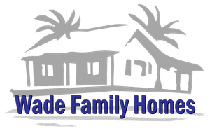 Logo for Wade Family Homes featuring a grey outline of a house with palm trees, with blue text below.