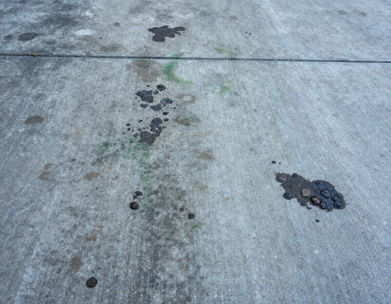 Driveway before pressure washing