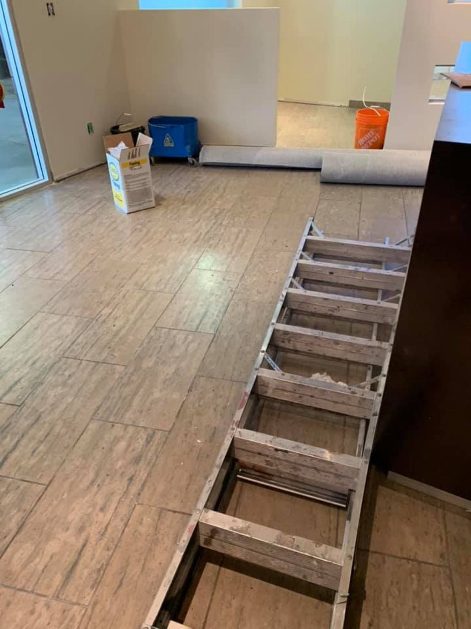 Post-construction cleanup underway in a partially renovated commercial space