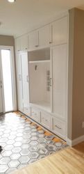 Entryway after residential cleaning with custom cabinetry and tile detailing