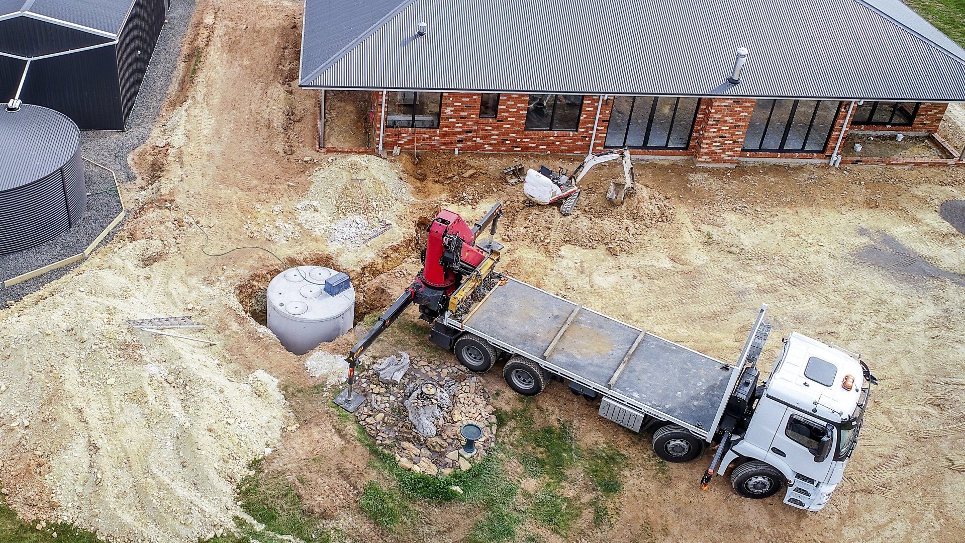 Septic tank near a beautiful house | Birch Run, MI | Duane Jones Excavating